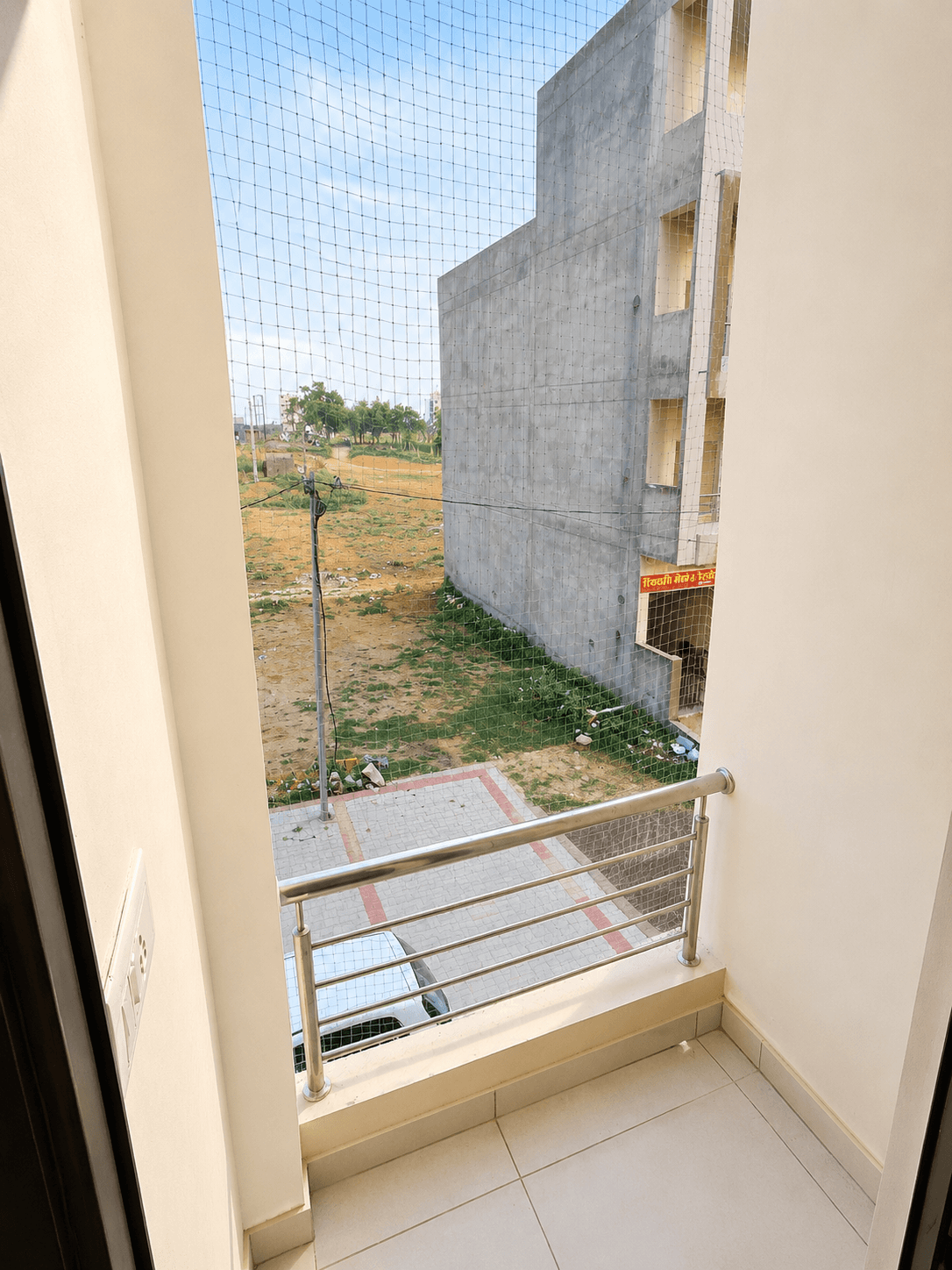 A beautifully set dining table with white tablecloth, cutlery, and fresh greenery in a cozy, well-lit space.